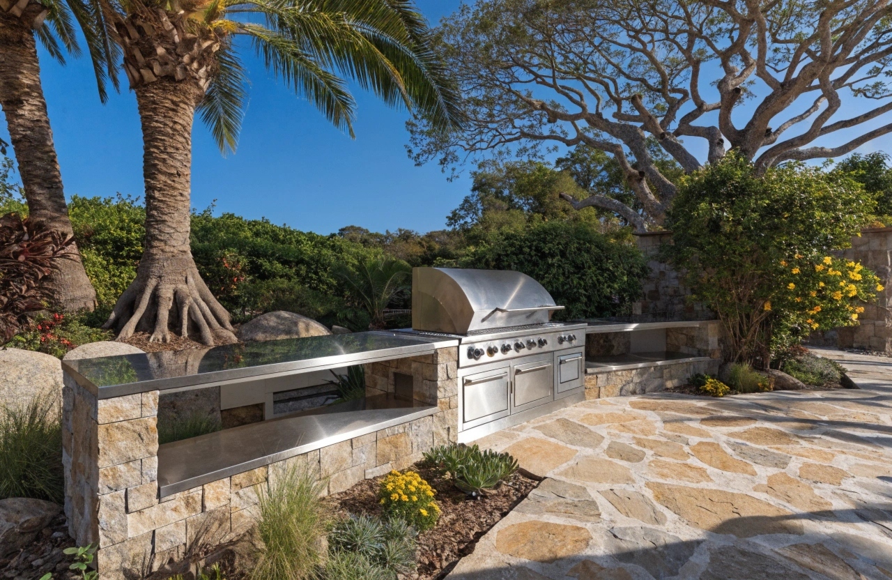 Clean built-in outdoor kitchen with stainless steel BBQ after professional service